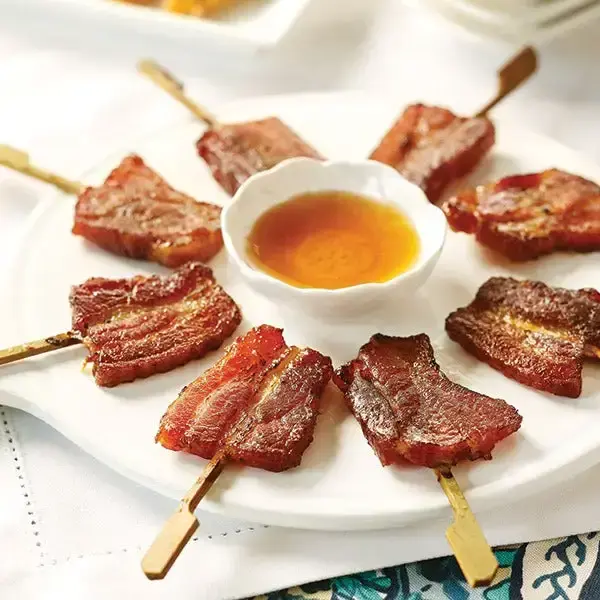 Bacon Lollipops on skewers served Vanilla-Bourbon Glaze